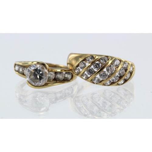 938 - Two 14ct gold/tests 14ct CZ set rings, finger sizes L/M, P, total weight 6.8g.