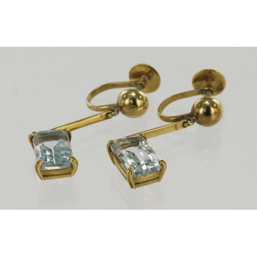 944 - Pair of yellow gold (tests 18ct) aquamarine drop earrings, one step cut aquamarine measuring approx.... 