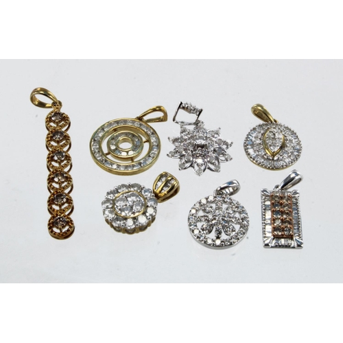 950 - Seven 9ct gold diamond set pendants, total weight 12.1g.