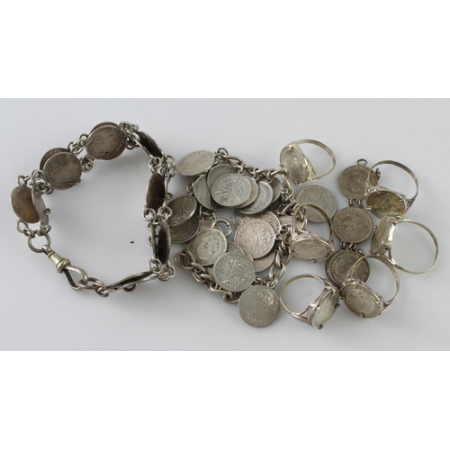 952 - Assortment of silver jewellery with silver and white metal coins, total weight 107.8g.