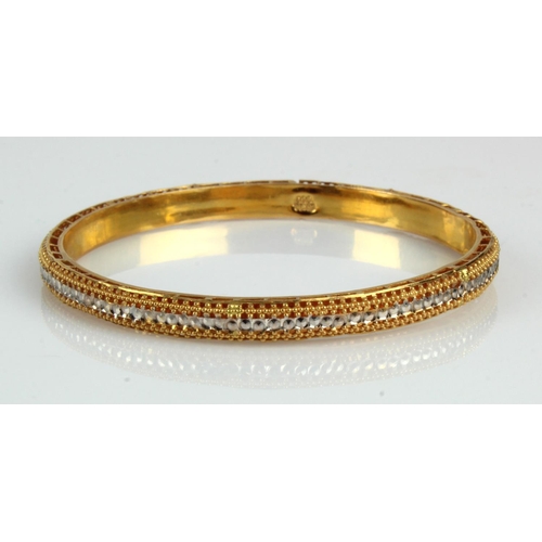 955 - Yellow gold (tests 21ct) slave bangle, white gold filigree design, width 5.5mm, inside diameter 63mm... 