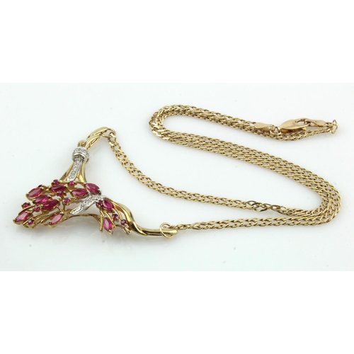 966 - 9ct yellow gold diamond and ruby necklace, wishbone shaped pendant set with ten marquise shaped rubi... 