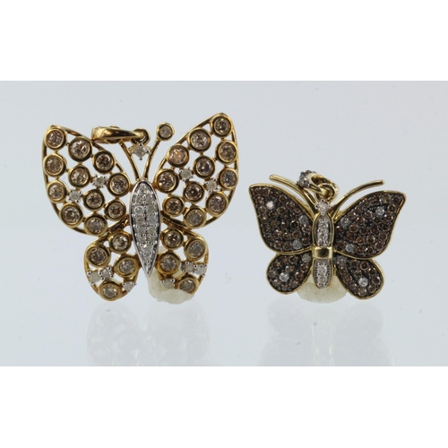 971 - Two 9ct yellow gold diamond set butterfly pendants, both with white and champagne coloured diamonds,... 