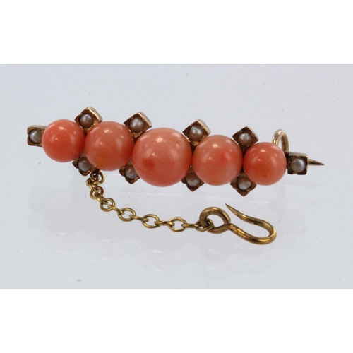 973 - Yellow gold (tests 18ct) antique coral and seed pearl brooch, five graduating coral, principle appro... 