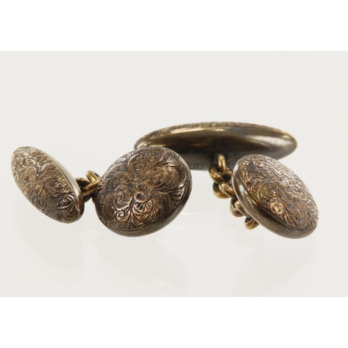 977 - Pair of yellow gold (tests 15ct) antique cufflinks, profusely engraved, total weight 5.6g.