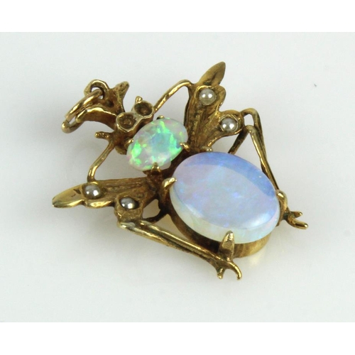 978 - Yellow gold (tests 9ct) bug pendant, set with two opals, principle measures 9mm x 8mm, four seed pea... 