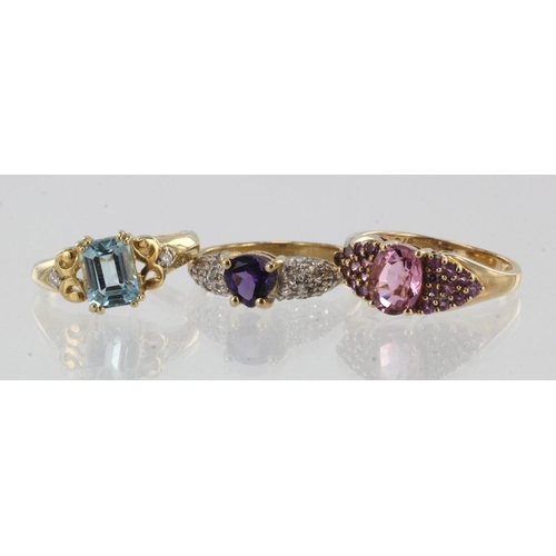 984 - Three 9ct gold gem set dress rings, stones include diamond, pink tourmaline, topaz, amethyst, finger... 