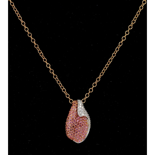 988 - Rose gold (tests 18ct) diamond and pink sapphire necklet, pave set pendant set with pink sapphires a... 