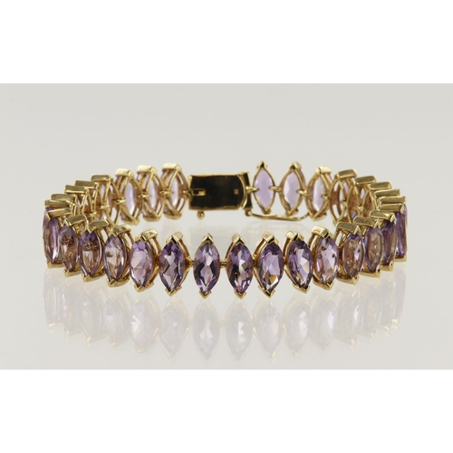 991 - 9ct yellow gold amethyst bracelet, thirty-one marquise 10mm x 5mm amethysts, TGW 30.984ct, length 7.... 