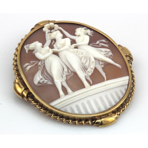 999 - Yellow gold (tests 9ct) carved cameo brooch, depicting the three graces, brooch measures 65mm x 55mm... 