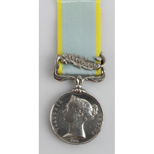 1041 - Crimea Medal 1854 with Sebastopol clasp, engraved (L. Lewis 1955 L.T.C.)  served 1st Div Land Transp... 