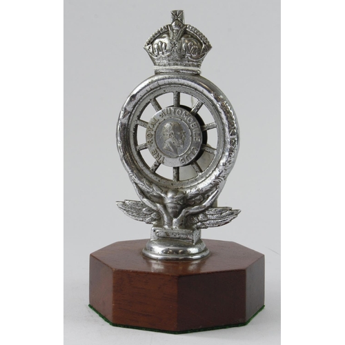 1064 - Early Pre-War Royal Auto Mobil Club Car Badge mounted on a teak plinth.