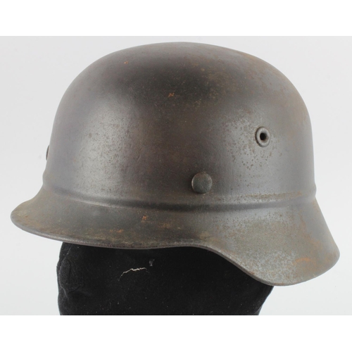 1137 - German 3rd Reich M40 Helmet with liner, no decals. Stamped '1534' and 'NS62' to inside rim