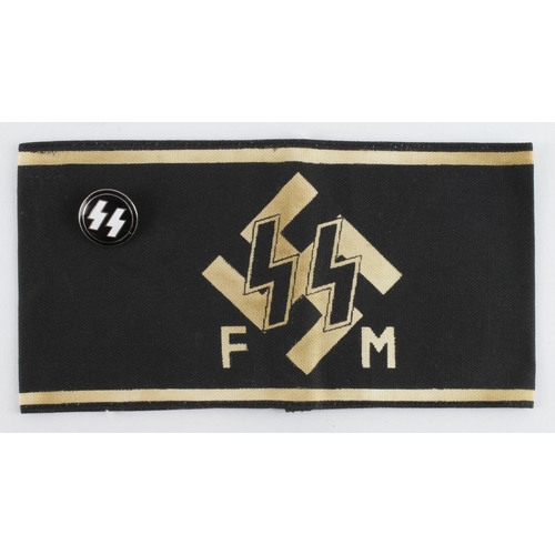 1256 - German SS Helpers FM armband and a Lapel badge.