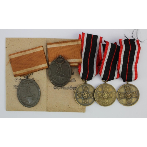 1277 - German West Wall medals 2x in packets and War Merit medals 3x.