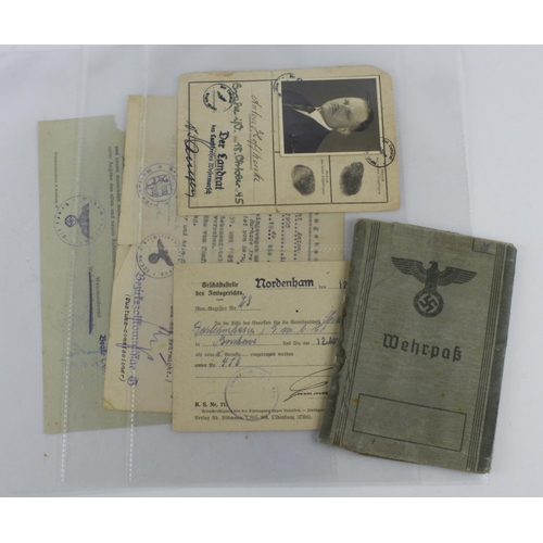 1308 - German WW2 soldiers documents with Wehrpak, ID cards etc.