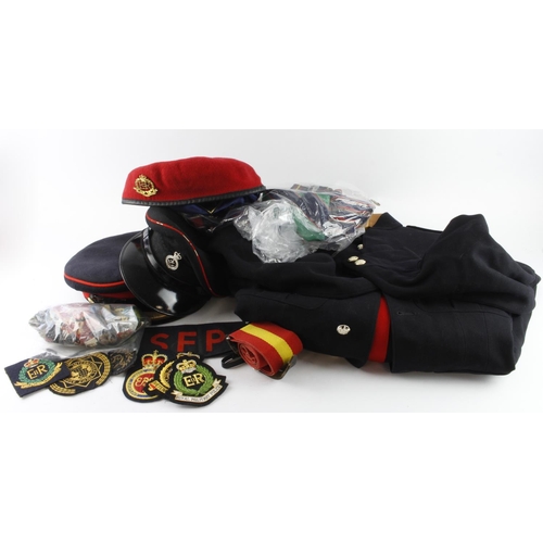 1393 - Large box of various military peaked caps, a uniform, bundle of cloth div patches, blazer badges, et... 