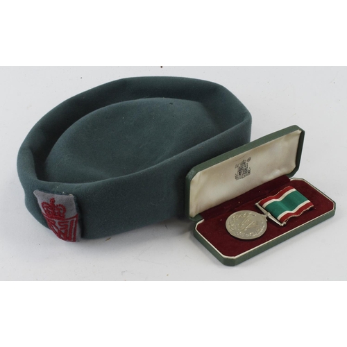 1645 - WVS woman’s hat and service medal in case.