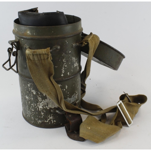 1868 - WW2 scarce Hungarian gas mask in its 1938 metal storage tin complete with straps.