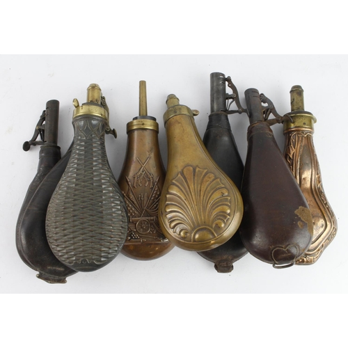 769 - Powder and shot flask grouping for sporting guns: 19th Century, being four embossed copper and brass... 