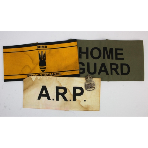 859 - ARP an unusual Air Raid Precations badge and 3 later made armbands.