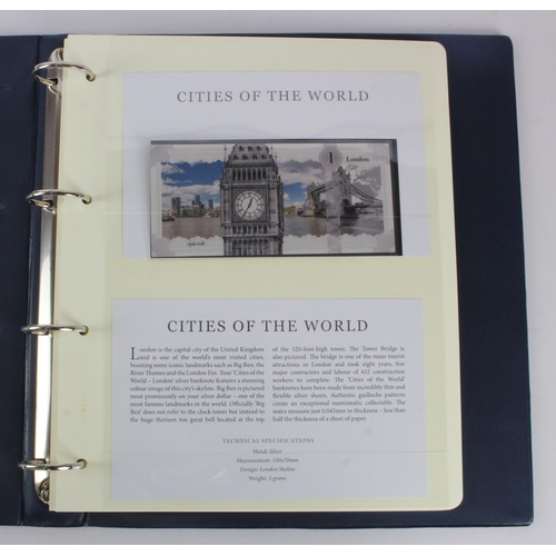 1 - An album of 'Cities of the World' silver notes minted from 5g of pure .999 silver, 10 notes each wit... 