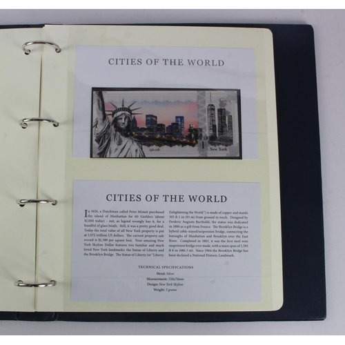 1 - An album of 'Cities of the World' silver notes minted from 5g of pure .999 silver, 10 notes each wit... 