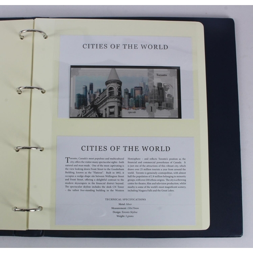 1 - An album of 'Cities of the World' silver notes minted from 5g of pure .999 silver, 10 notes each wit... 