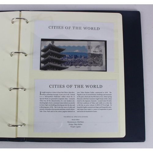 1 - An album of 'Cities of the World' silver notes minted from 5g of pure .999 silver, 10 notes each wit... 