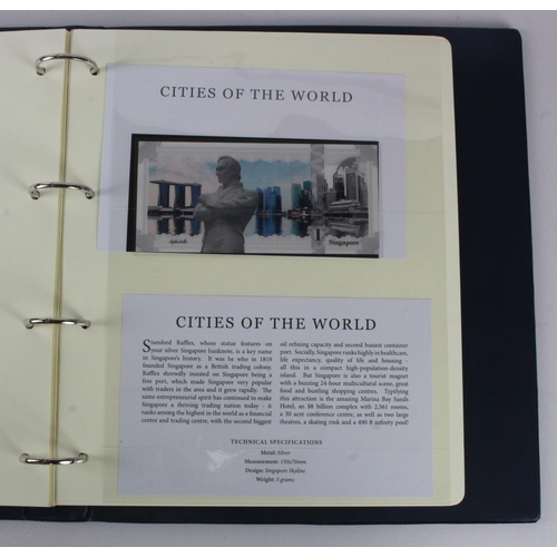 1 - An album of 'Cities of the World' silver notes minted from 5g of pure .999 silver, 10 notes each wit... 