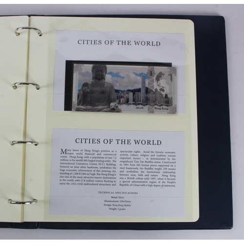 1 - An album of 'Cities of the World' silver notes minted from 5g of pure .999 silver, 10 notes each wit... 