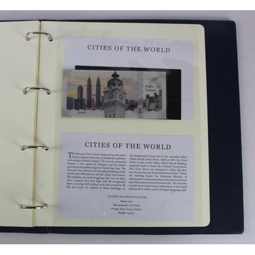 1 - An album of 'Cities of the World' silver notes minted from 5g of pure .999 silver, 10 notes each wit... 