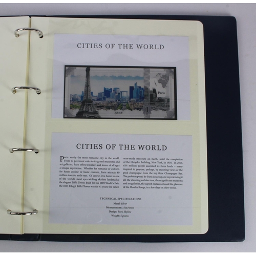 1 - An album of 'Cities of the World' silver notes minted from 5g of pure .999 silver, 10 notes each wit... 