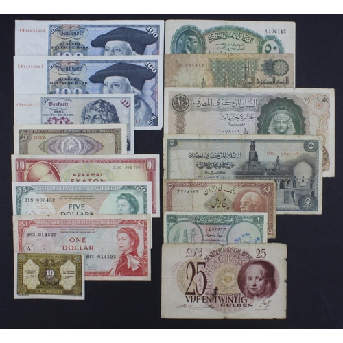 955 - World (15), comprising Netherlands 25 Gulden 1945, Qatar Dubai 1 Riyal 1960's, Iran 5 Rials 1938, Eg... 