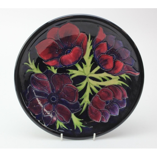 107 - Moorcroft 'Anemone' pattern plate, makers marks to reverse, diameter 26cm approx.