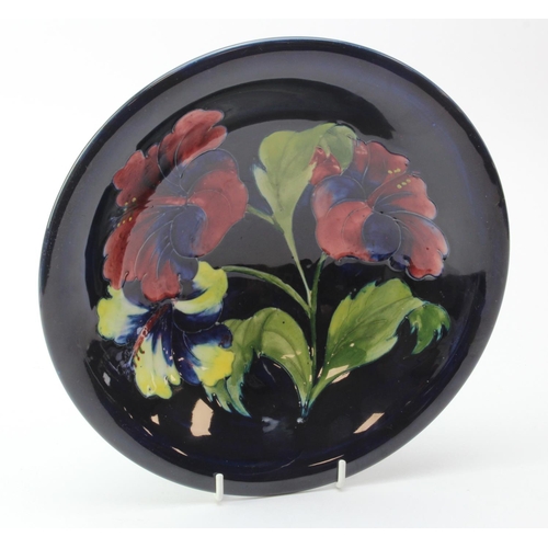 111 - Moorcroft 'Hibiscus' pattern bowl, makers marks and paper label to base, diameter 24.5cm, height 5.5... 