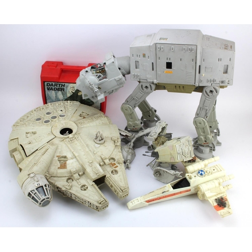 268 - Star Wars. A group of four Star Wars vehicles, including Millennium Falcon & AT AT, together with a ... 