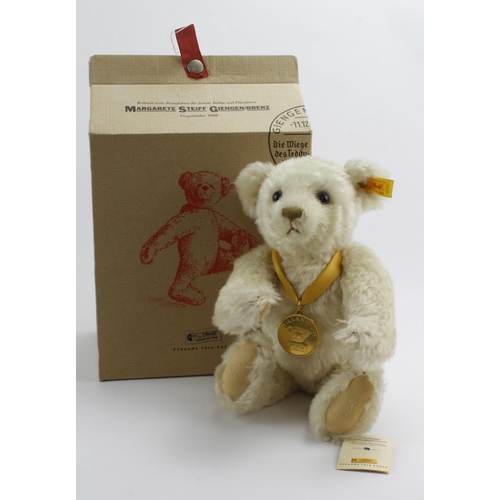 271 - Steiff Millenium bear, with medal round his neck, height 22cm approx., contained in original box