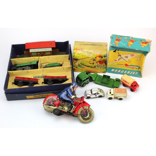 275 - Tinplate. A group of various tinplate toys, including Hornby O gauge train set, motorcycle with ride... 