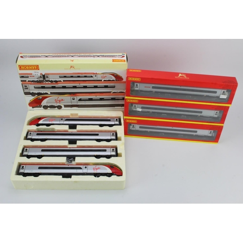 319 - Hornby. A Hornby boxed OO gauge 'Virgin Trains Pendolino train pack' (R2467)', together with three b... 