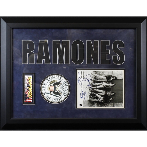 58 - Ramones. A signed black & white photograph of all four members of the Ramones, comprising Joey Ramon... 