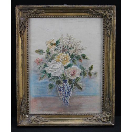 63 - Victorian silk embroidery depicting a still life of a vase of flowers. Measures approx 26.5cm x 32cm... 