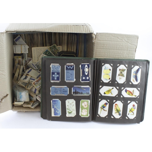 641 - Box of loose old cigarette cards and tea cards, including a few tins and old loose album (Qty)  Buye... 