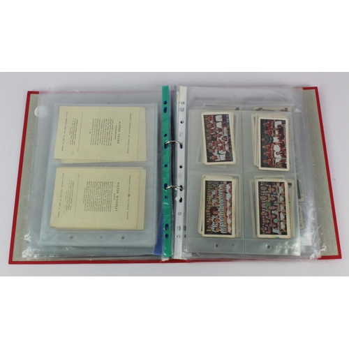 724 - Football - red binder containing 14 complete sets of trade issues in pages, includes issues from Tho... 