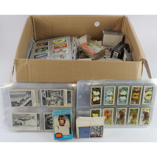 750 - Large box containing approx 88 complete sets of trade issues, in pages, packets, etc, mainly VG with... 