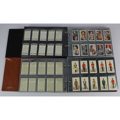 775 - Modern albums (x2) of cigarette card sets in sleeves (not checked) incl Ogdens Picturesque People of... 