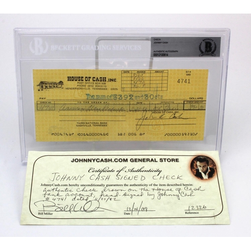 895 - Johnny Cash signed cheque (check), dated 29/11/82, comes sealed in a Beckett Grading Services hard p... 