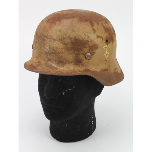 204 - German Afrika Korps steel helmet, M35, Palm tree to side, complete with liner, service wear.