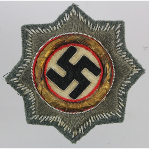 223 - German Deutches Kreuz in gold, cloth combat wear version, Wehrmacht / Waffen SS backing material.