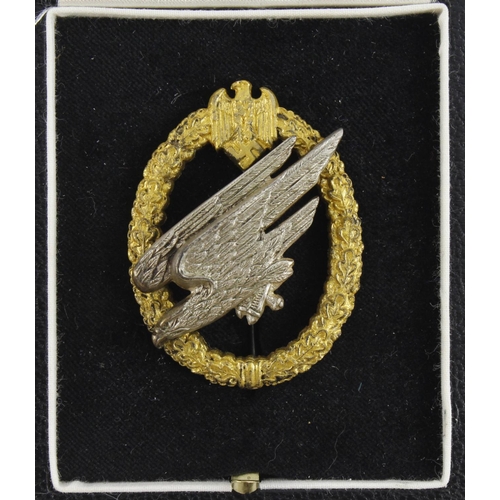 234 - German Fallschiermjager Paratroopers War badge in case maker marked C E Junker Berlin.